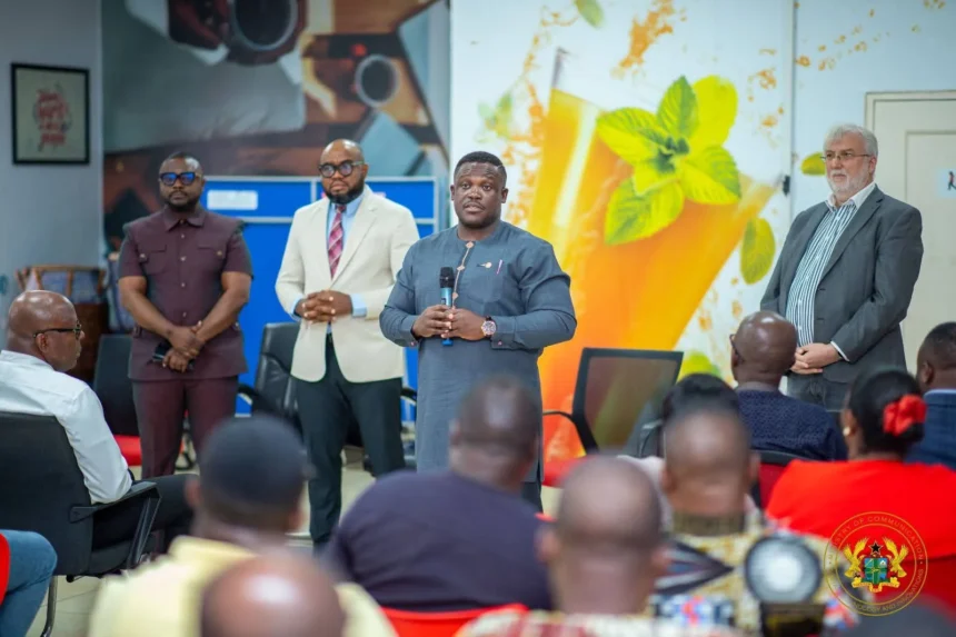 AT staff and Minister Samuel George at briefing on Telecel merger