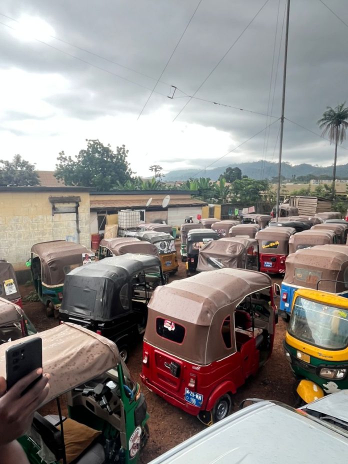 More than 175 tricycle riders have been arrested in Bibiani, in the Bibiani Anhwiaso Bekwai Municipality of the Western North Region, for flouting road safety regulations. The arrests were made during a special operation carried out by the Motor Transport and Traffic Directorate (MTTD), targeting unregistered tricycles and operators without valid driver’s licenses. ASP Emmanuel Osei, Divisional MTTD Commander for Bibiani, led the operation. According to officials, the crackdown is part of efforts to ensure compliance with national traffic laws and reduce road accidents in the municipality. Some of the affected riders reportedly pleaded with officers at the time of arrest. However, ASP Osei insisted that all operators must regularize their documents before their tricycles would be released. He emphasized that these measures are not punitive but necessary to safeguard lives and maintain discipline on the roads. In an interview, Mr. Anthony Fiifi Affum, Chairman of the Bibiani Tricycle Riders Association, backed the enforcement exercise. He commended the MTTD for its commitment to road safety and urged all riders to comply with licensing and registration requirements to avoid future inconveniences. The operation has drawn attention across the municipality, with many residents welcoming the move as a step toward restoring order and accountability in local transportation. GhanaAtinkaonline.com| Obofo Michael