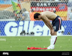 USA's Landon Donovan stands on the pitch after the USA lost to Ghana at 2006 World Cup at Frankenstadion in Nuremberg, Germany.